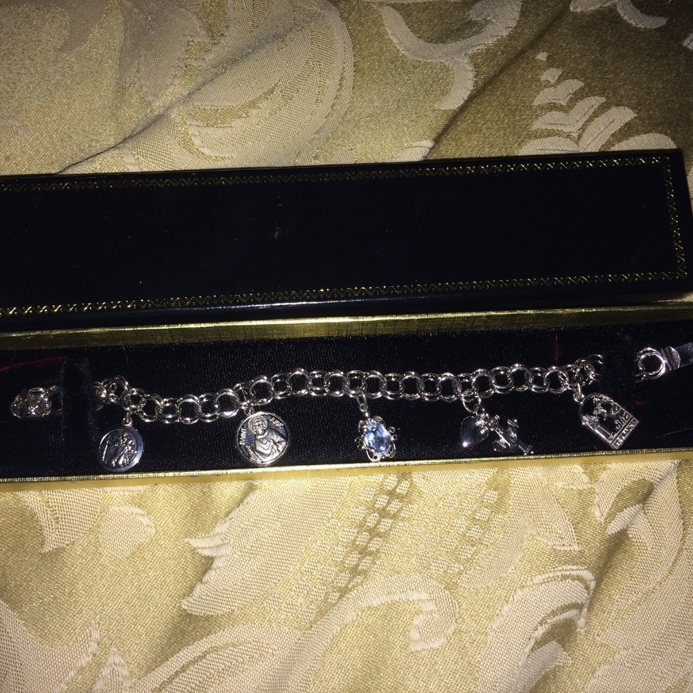 ROC Sterling Silver charm bracelet w/5 charms, centre charm aquamarine.